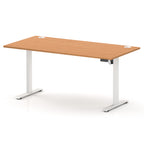 An adjustable height standing desk with a light brown wood grain top and white metal legs, shown on a clean white background.