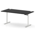 A modern height-adjustable standing desk with a black rectangular desktop and white metal legs, shown on a clean white background.