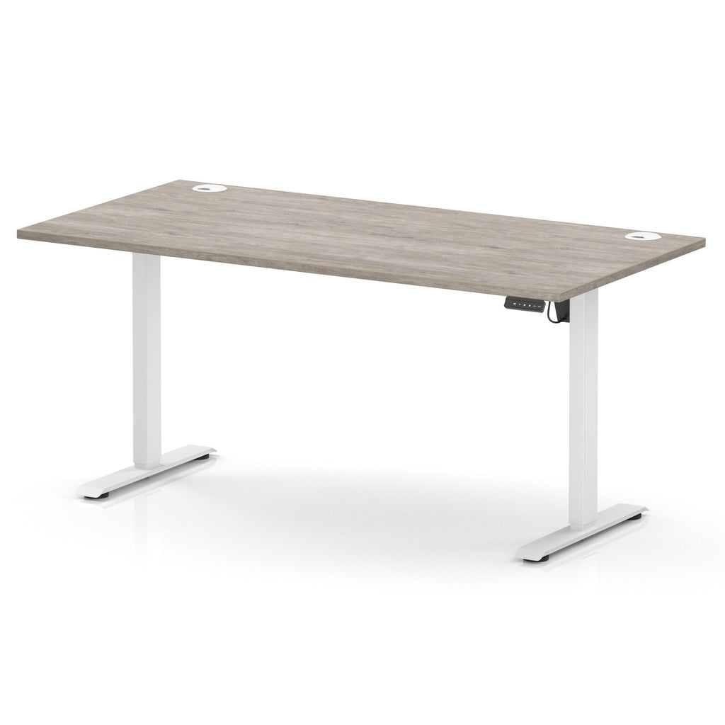 A modern height-adjustable standing desk with a light grey wood-grain top and white metal legs, shown on a clean white background.