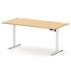 A modern height-adjustable standing desk with a light oak wood grain top and white metal legs, shown on a clean white background.