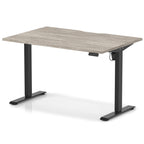 Height adjustable desk with grey wood-effect top and black frame on a white background