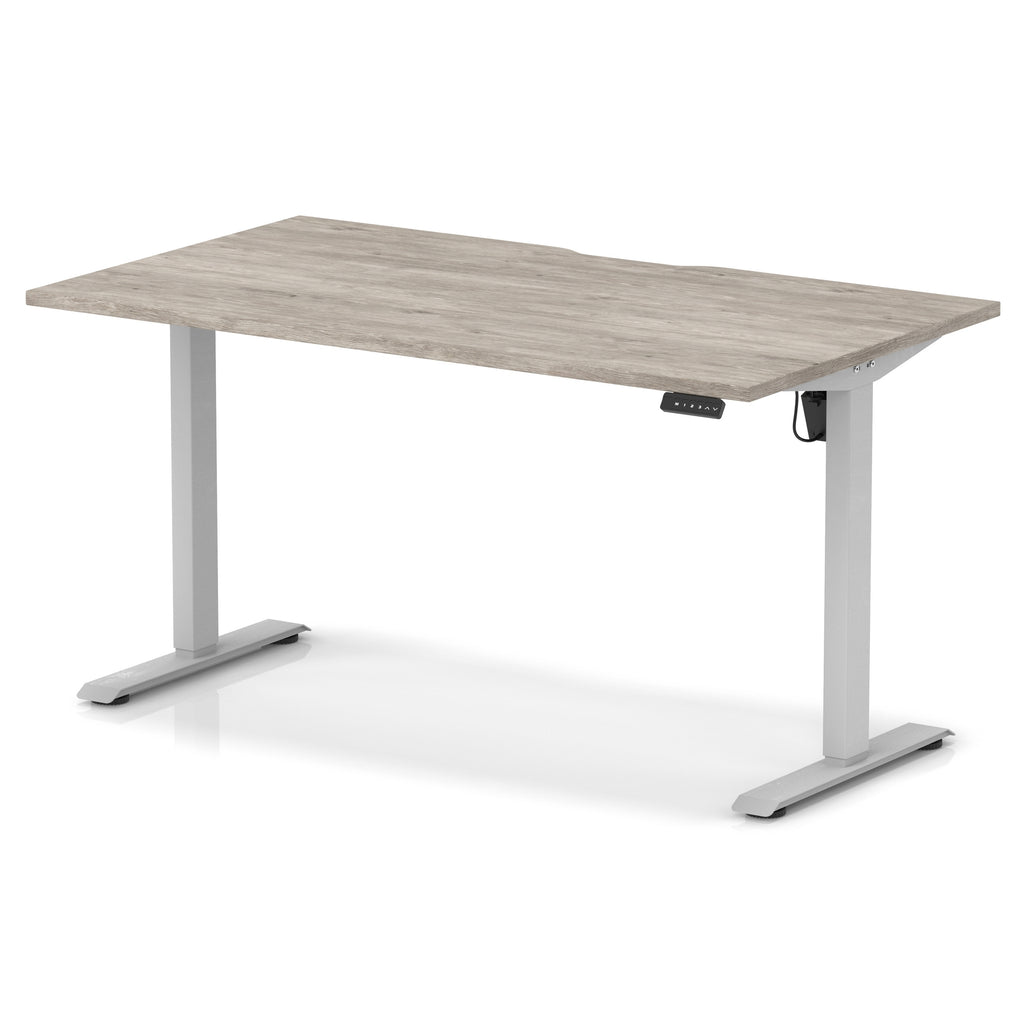 Height adjustable desk with grey wood-effect top and silver frame on a white background