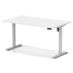 Height adjustable desk with white top and silver frame on a white background