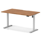 Height adjustable desk with wood-effect top and silver frame on a white background