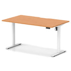 Height adjustable desk with wood-effect top and white frame on a white background