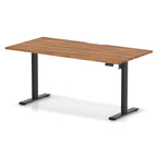 Height adjustable desk with wood-effect top and black frame on a white background