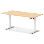 Height adjustable desk with wood-effect top and white frame on a white background
