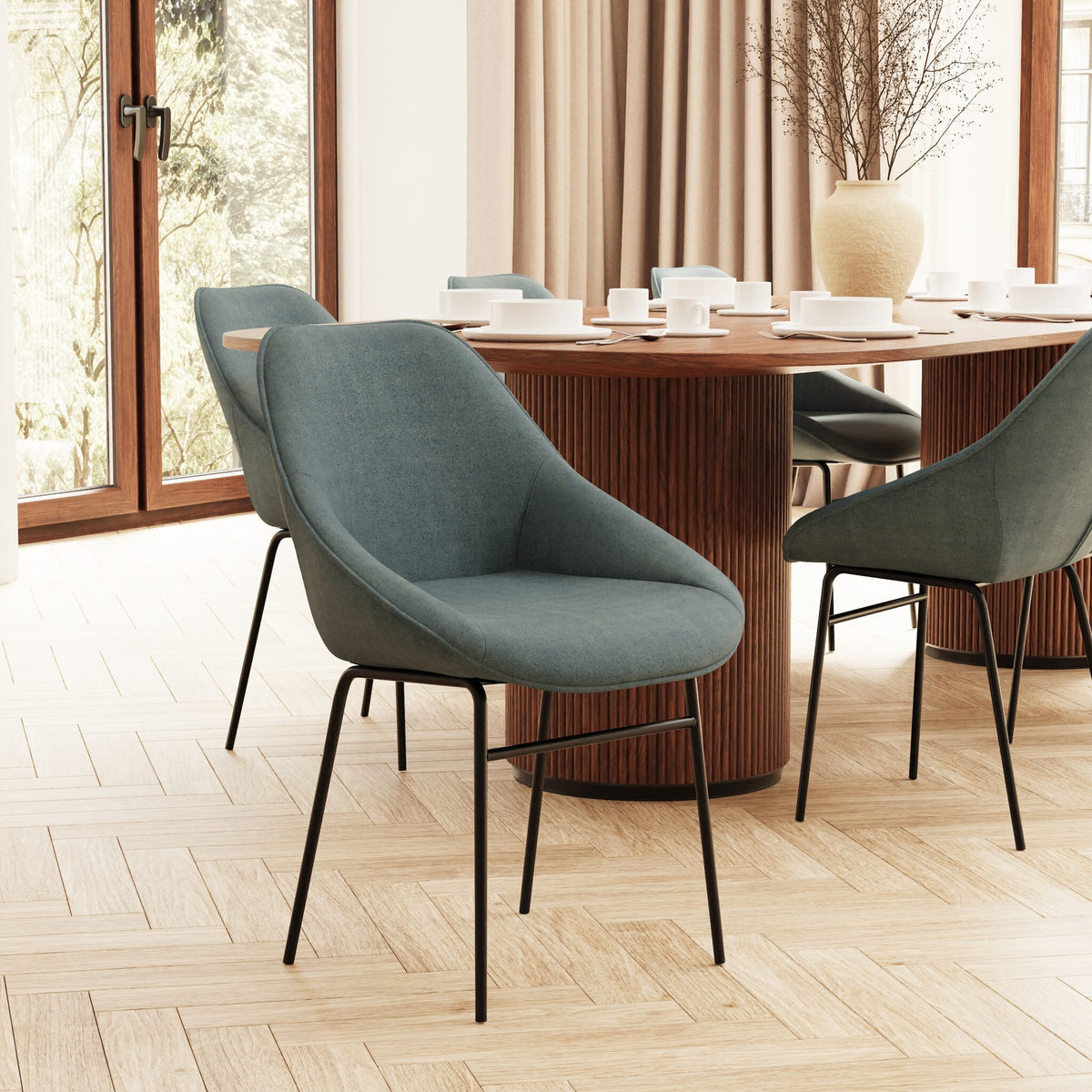 Modern dining room with a wooden table and grey chairs.