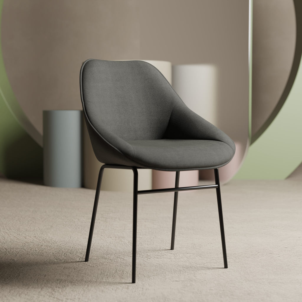 Grey chair with black legs in a minimalistic setting