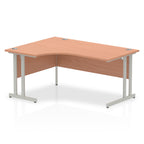  L-shaped desk with wood-effect top and metal legs on a white background
