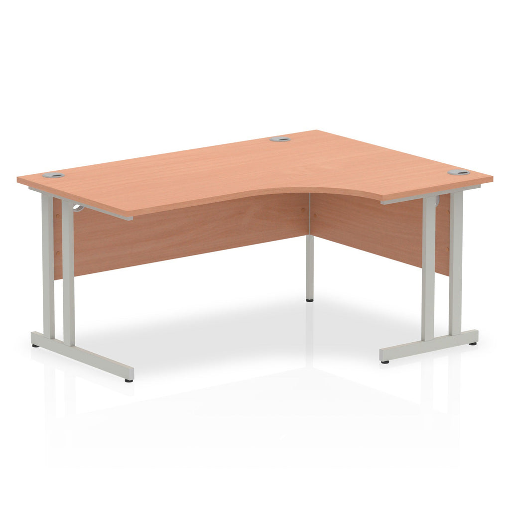 Wood-effect L-shaped desk with metal legs on a white background
