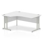 White L-shaped desk with silver metal legs on a white background