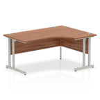 Wood-effect L-shaped desk with metal legs on a white background