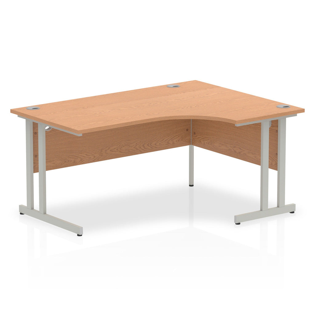 Wood-effect L-shaped desk with metal legs on a white background