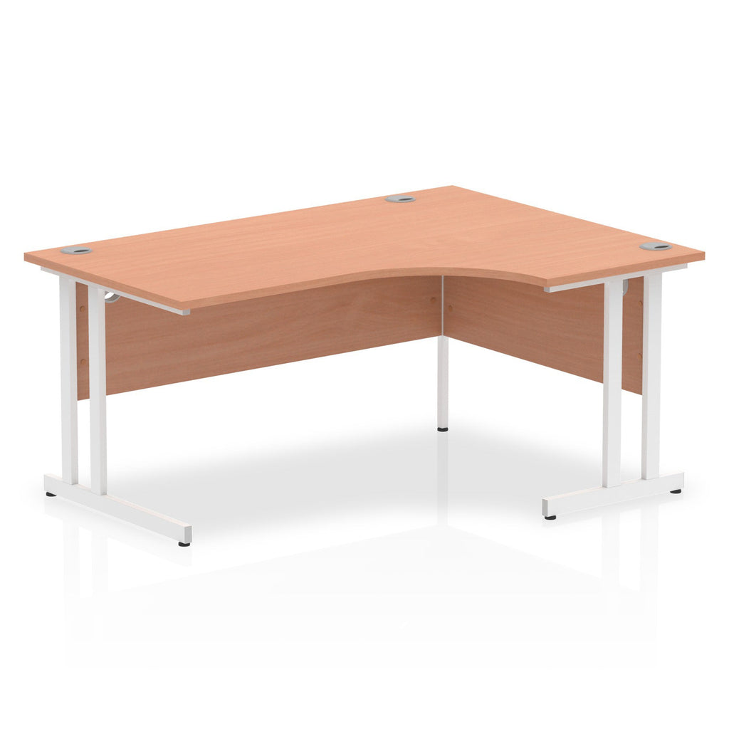 Wood-effect L-shaped desk with metal legs on a white background