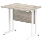 Grey wood-effect desk with cantilever metal legs on a white background