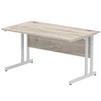 Office desk with wood-effect top and metal frame on a white background