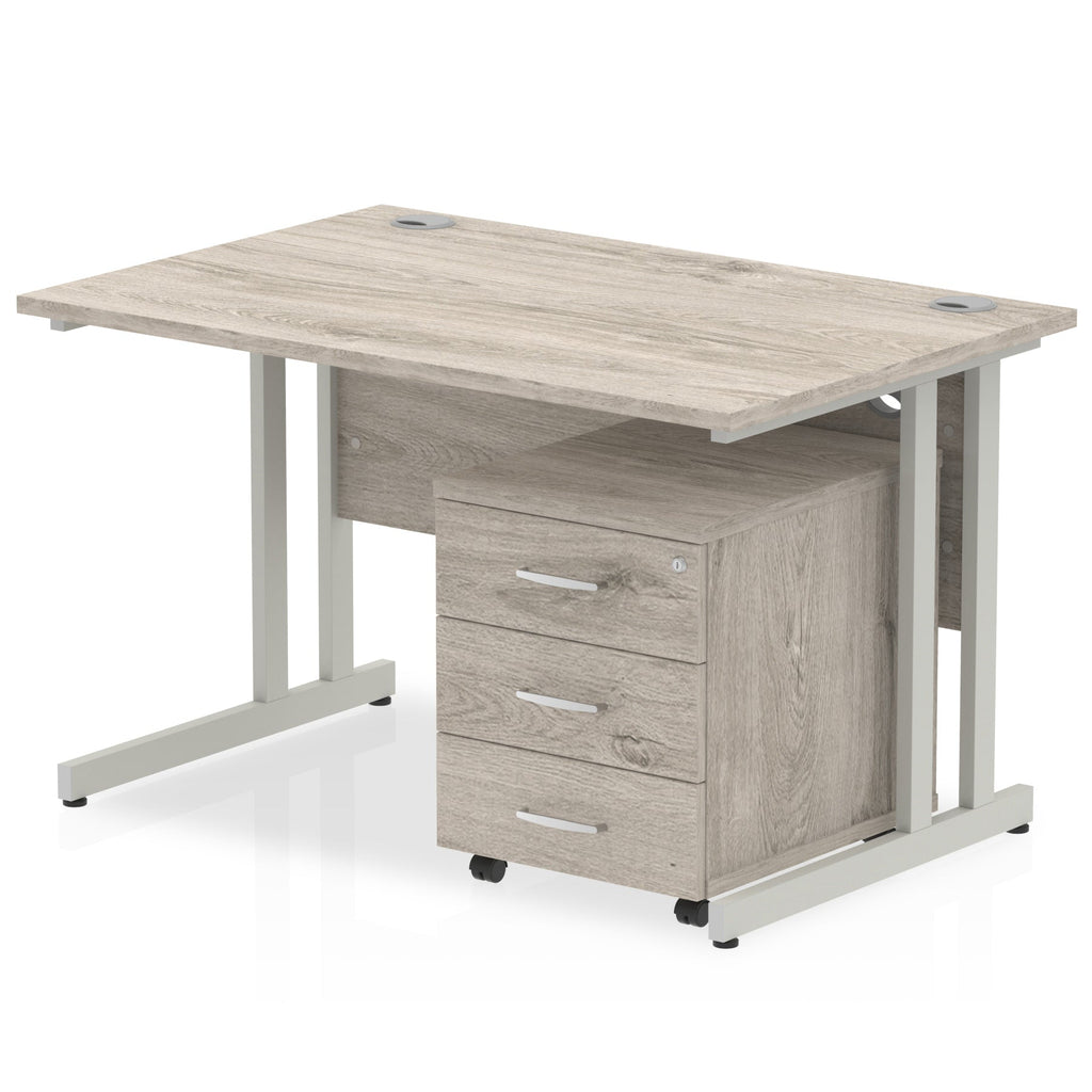 Grey wood-effect office desk with a matching pedestal unit and a metal frame on a white background