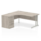Grey wood-effect L-shaped desk with metal legs on a white background