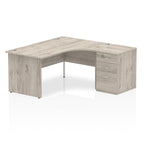 Wood-effect L-shaped desk with drawers on a white background
