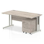 Grey wood-effect office desk with a matching pedestal unit and a metal frame on a white background