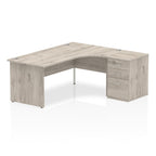 Wood-effect L-shaped desk with drawers on a white background