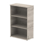 Wood-effect bookshelf with two shelves on a white background