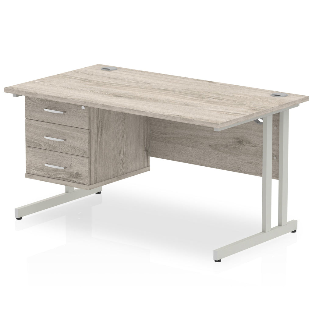 Grey wood-effect office desk with fixed pedestal and metal legs on a white background
