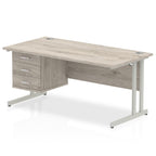 Wood-effect office desk with drawers and metal legs on a white background