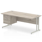 Office desk with grey wood-effect top, matching drawers and metal legs on a white background