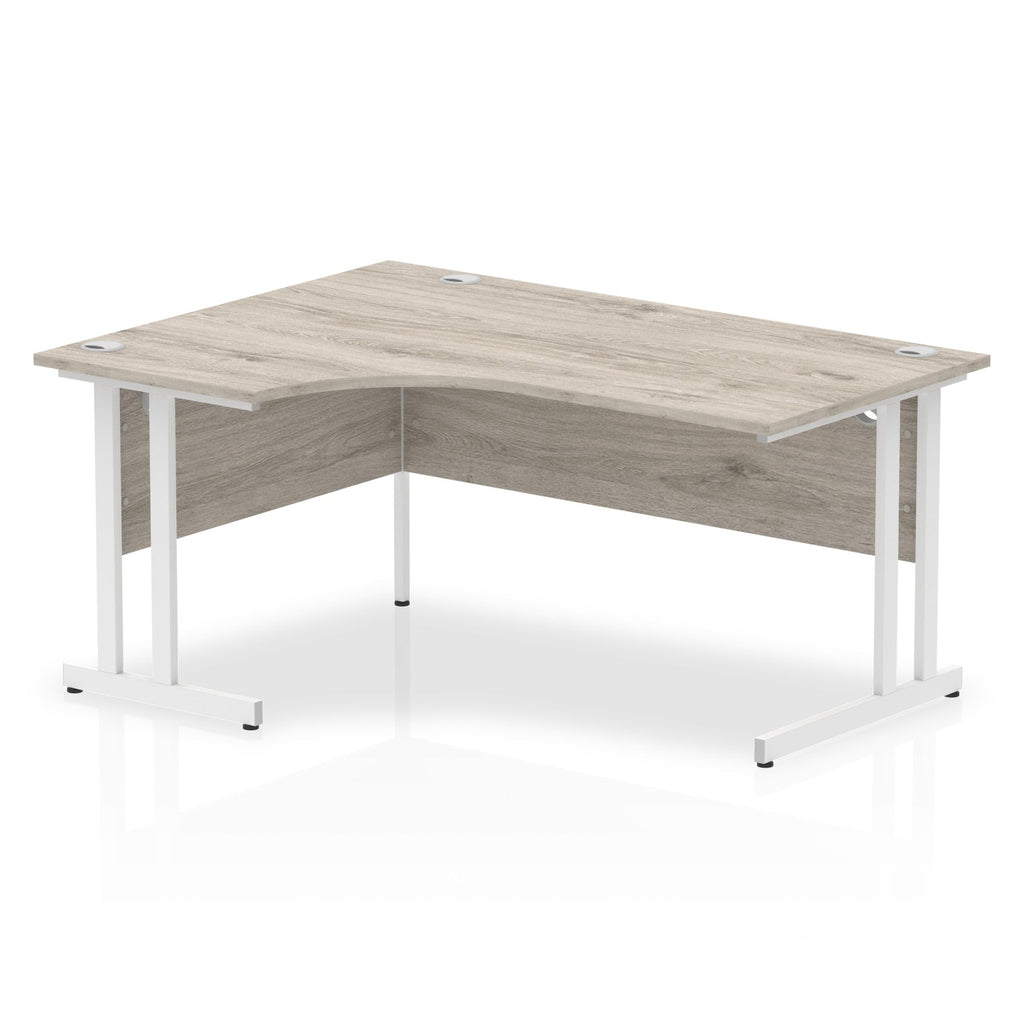  L-shaped desk with wood-effect top and metal legs on a white background