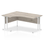  L-shaped desk with wood-effect top and metal legs on a white background
