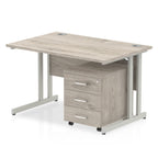 Grey wood-effect office desk with a matching pedestal unit and a metal frame on a white background