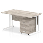 Grey wood-effect office desk with a matching pedestal unit and a metal frame on a white background