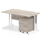 Grey wood-effect office desk with a matching pedestal unit and a metal frame on a white background