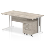 Grey wood-effect office desk with a matching pedestal unit and a metal frame on a white background