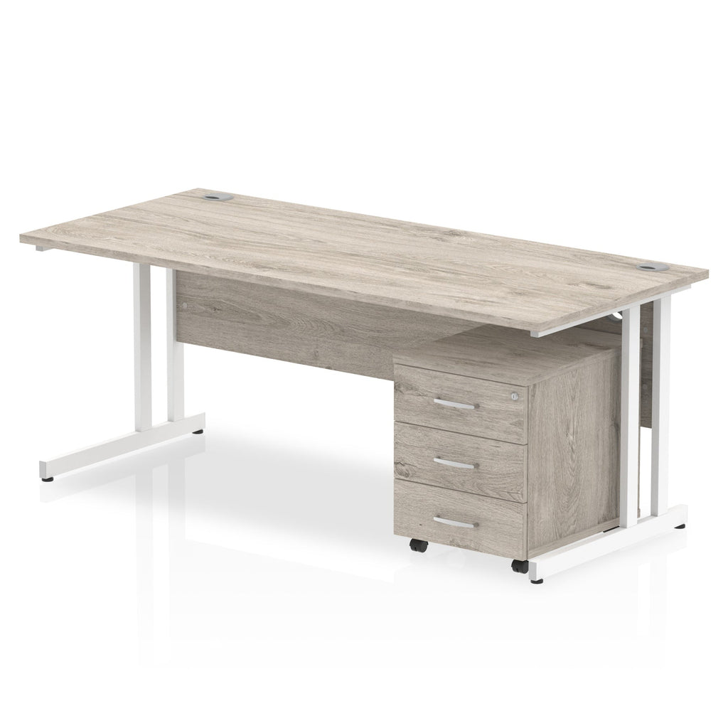 Grey wood-effect office desk with a matching pedestal unit and a metal frame on a white background