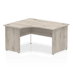 Grey wood-effect L-shaped desk on a white background