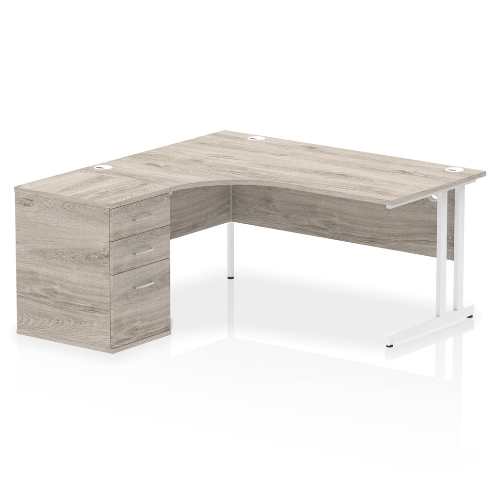 Grey wood-effect L-shaped desk with metal legs on a white background