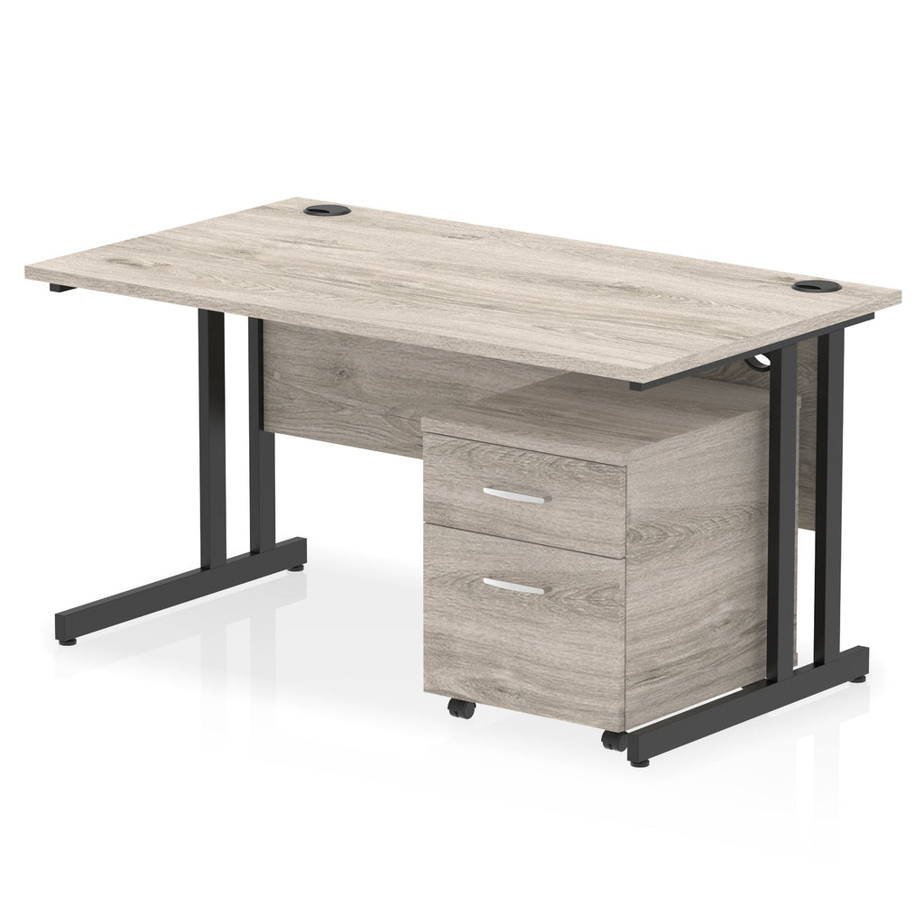 Grey wood-effect office desk with a matching pedestal unit and a metal frame on a white background