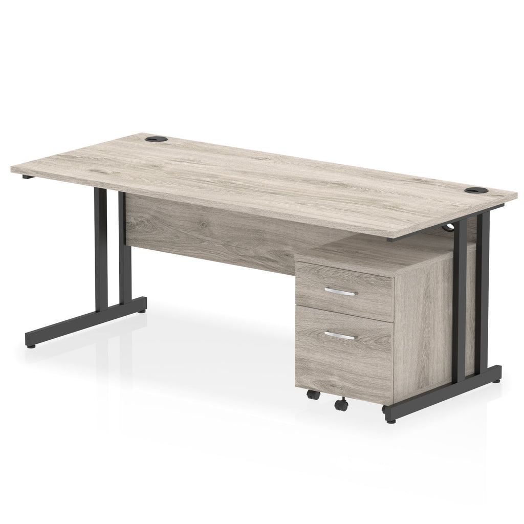 Grey wood-effect office desk with a matching pedestal unit and a metal frame on a white background