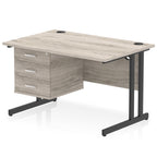 Office desk with grey wood-effect top and fixed pedestal with metal frame on a white background 