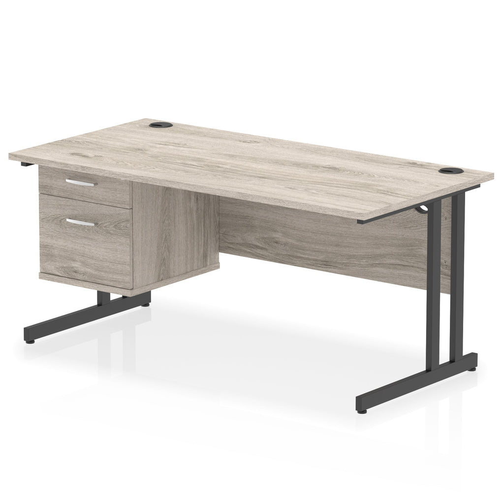 Wood-effect office desk with drawers and metal legs on a white background
