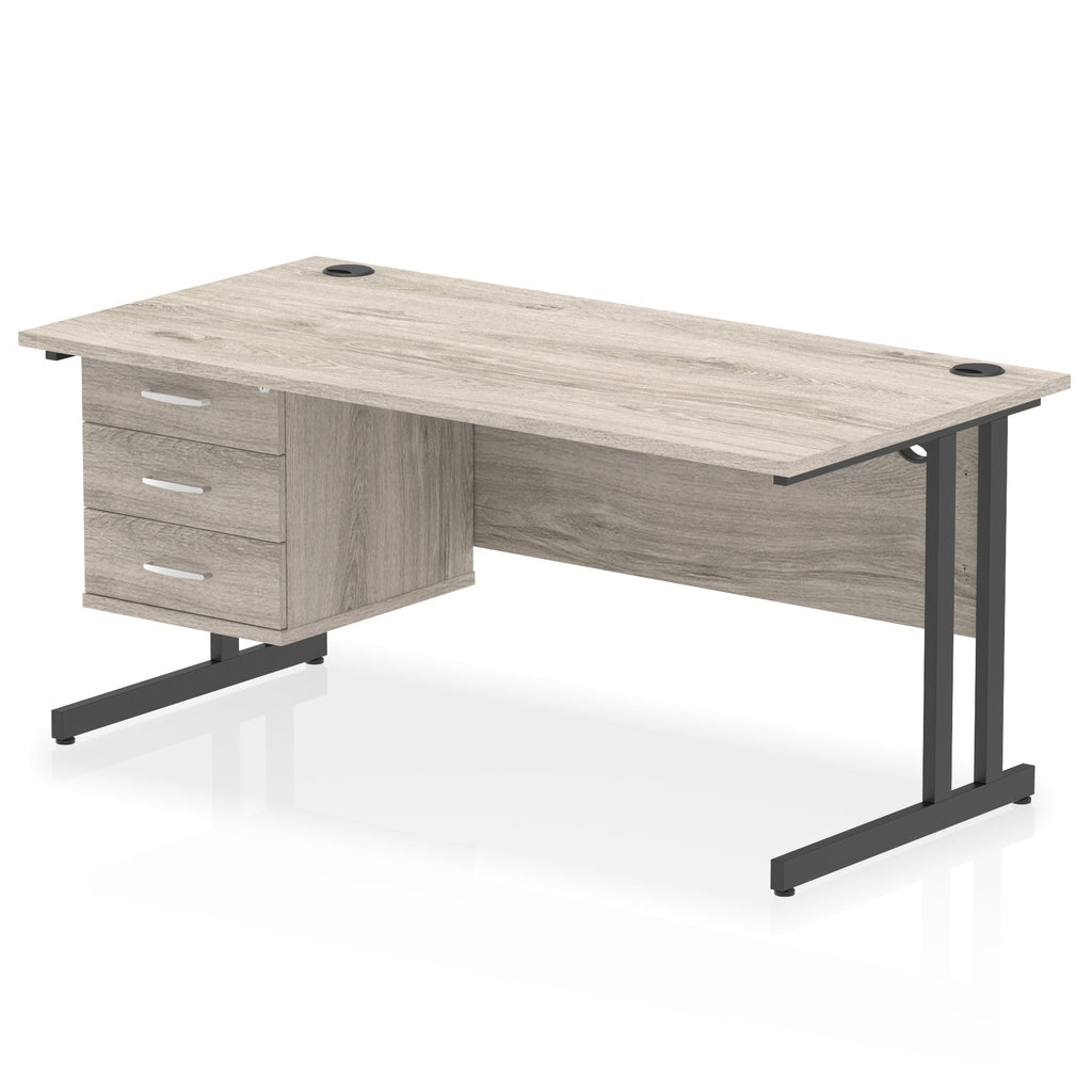 Wood-effect office desk with drawers and metal legs on a white background
