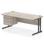 Office desk with grey wood-effect top, matching drawers and metal legs on a white background
