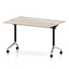 Rectangular table with a grey wood-effect flip top and black and chrome metal legs on wheels against a white background