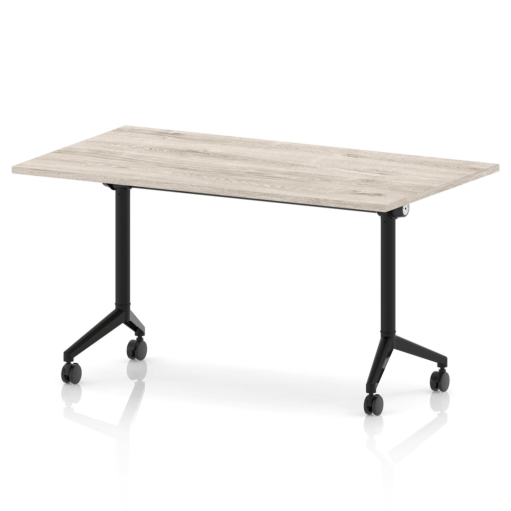 Rectangular table with a grey wood-effect flip top and black metal legs on wheels against a white background