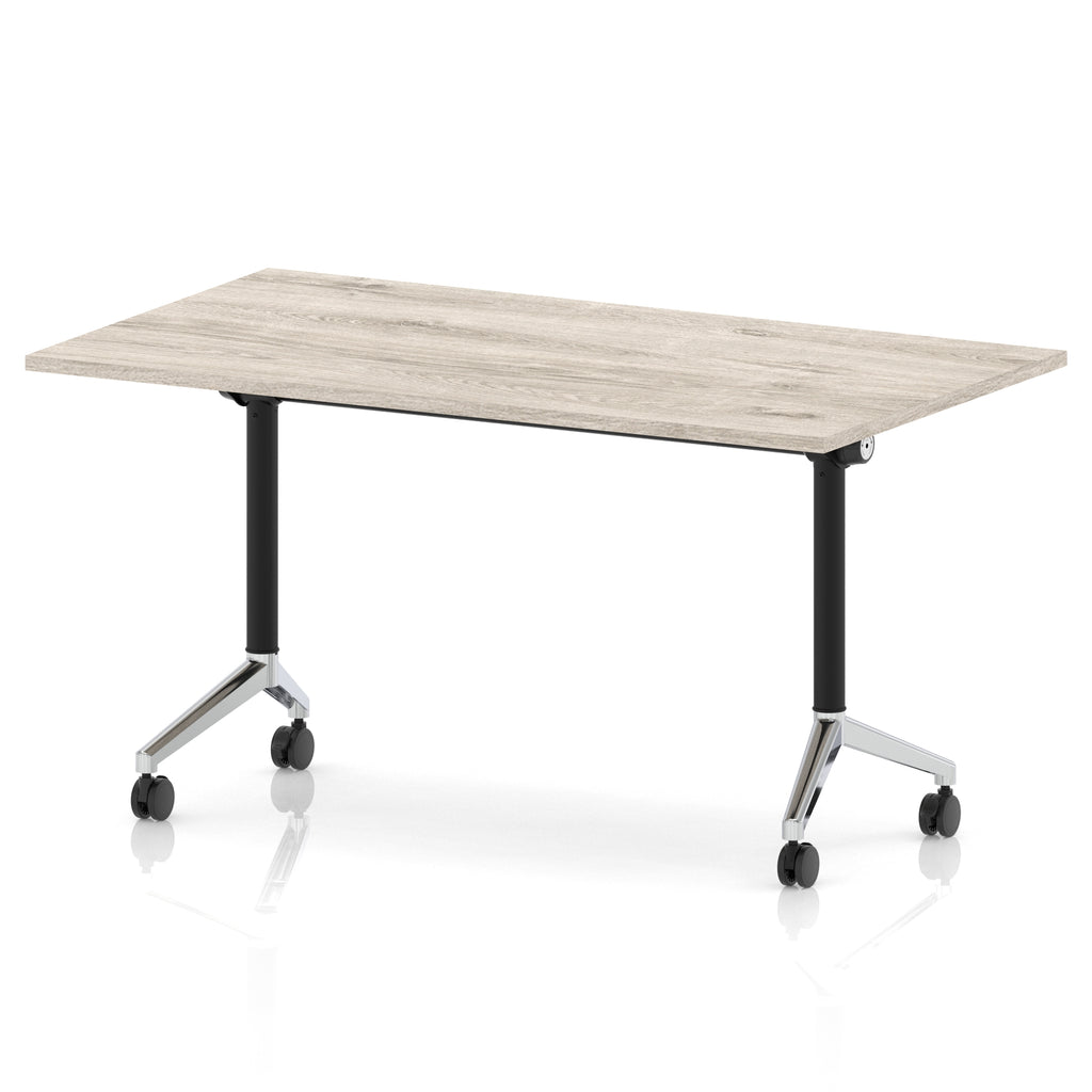 Rectangular table with a grey wood-effect flip top and black and chrome metal legs on wheels against a white background