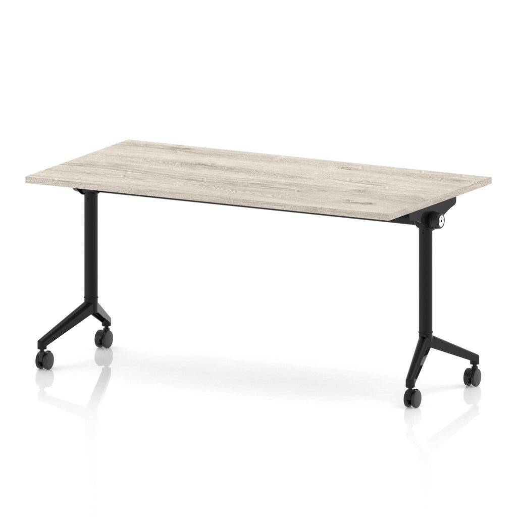Rectangular table with a grey wood-effect flip top and black metal legs on wheels against a white background