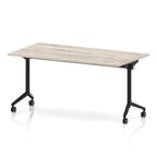 Rectangular table with a grey wood-effect flip top and black metal legs on wheels against a white background